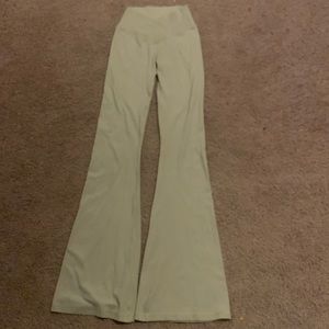 aerie flared leggings in a sort of beige/tan color.